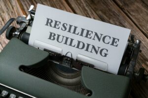 Image of a typewriter with paper that says Resilience Building.   Photo by Markus Winkler: https://www.pexels.com/photo/a-typewriter-with-the-word-resilience-building-on-it-18536266/
  